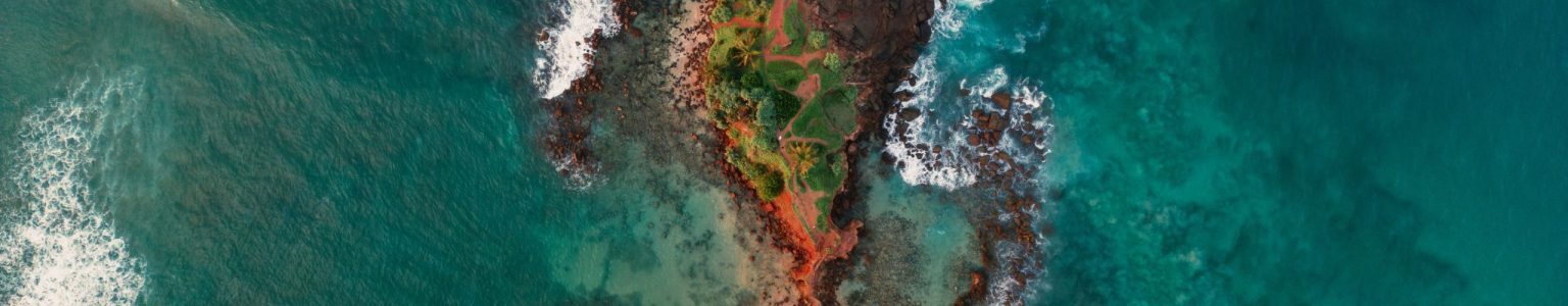 Aerial Drone View of Sri Lanka Small Island Parrot Rock, Mirissa Beach Scenic aerial drone view of Parrot rock - small island along the Mirissa Beach in Sri Lanka. Braking waves top view aerial photo from flying drone. Traveling and exotic countries concept. High quality photo